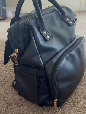 Black leather diaper bag gold accsents